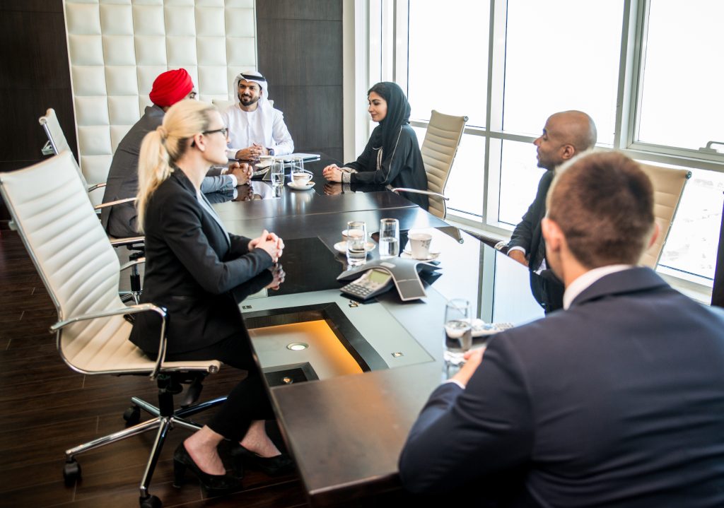 Conference room with diverse individuals highlighting the inclusivity at Lawgical Group.